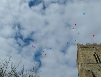 Balloons over tower